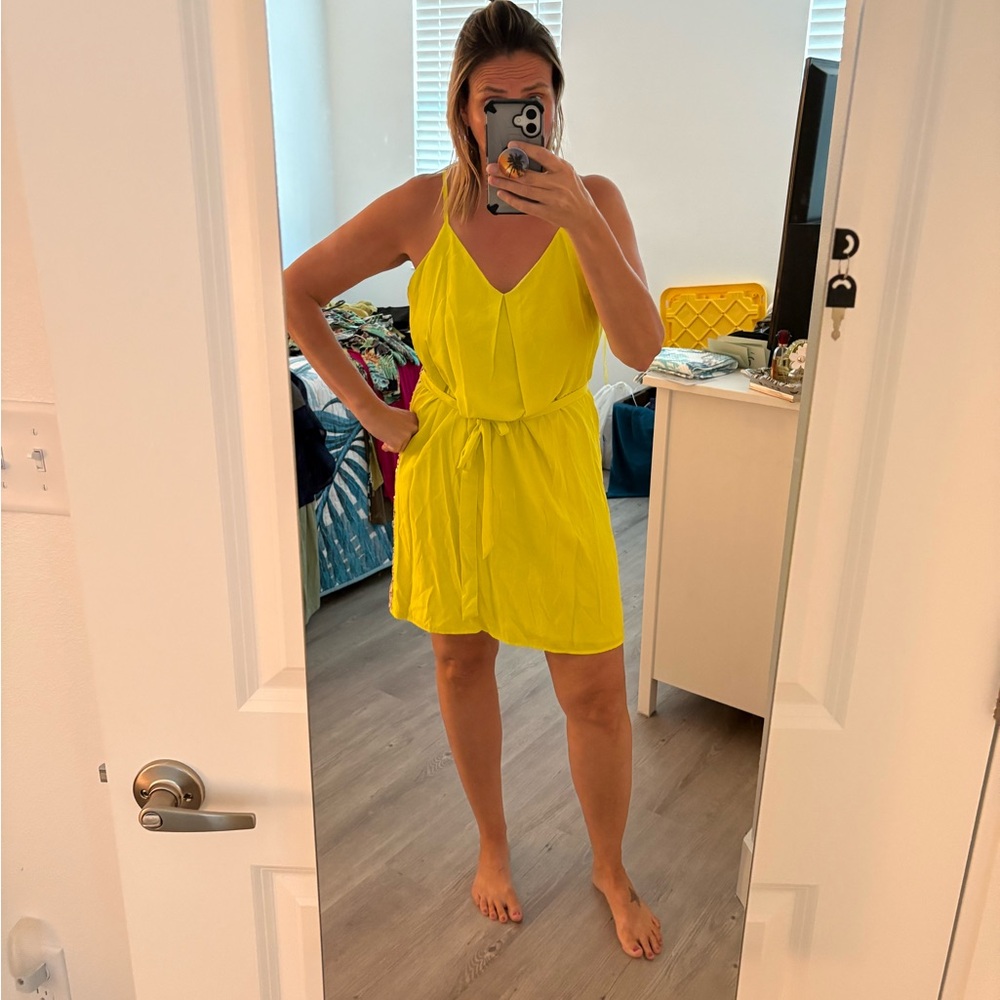 Cute yellow dress with gold sequin back.